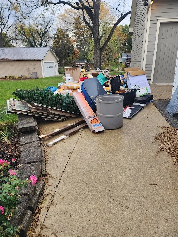 Dumpster being loaded with debris for 30 Yard Dumpster Rental in Moses Lake